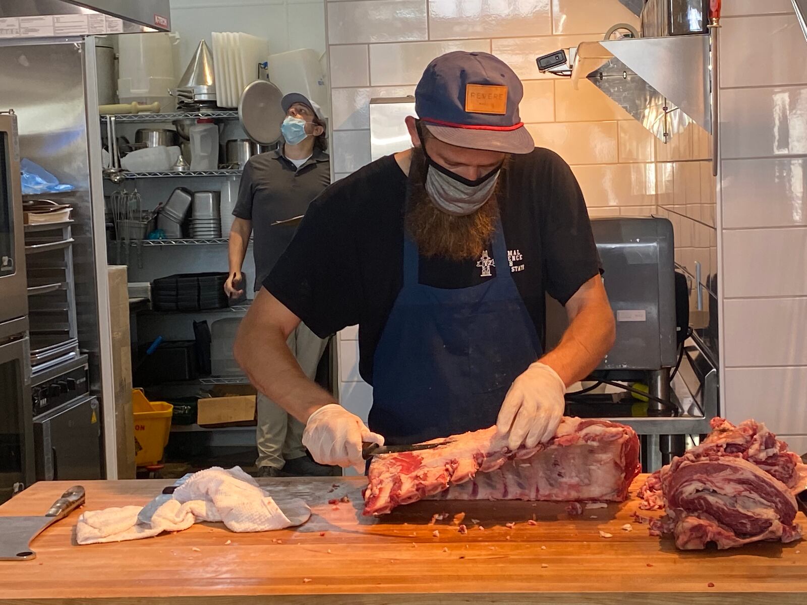 Kinship butcher Stephen Wagner breaks down half of a cow. The whole-animal butchery sources all of its proteins from Georgia farms. Ligaya Figueras/ligaya.figueras@ajc.com