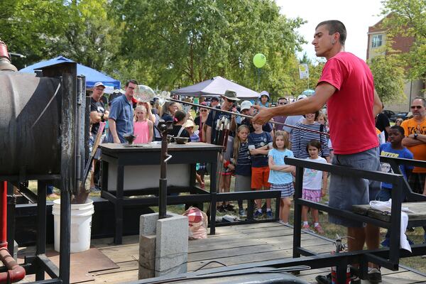 An artist from Janke Studios demonstrates glassblowing techniques to Maker Faire Atlanta attendees. CONTRIBUTED BY LEW LEFTON