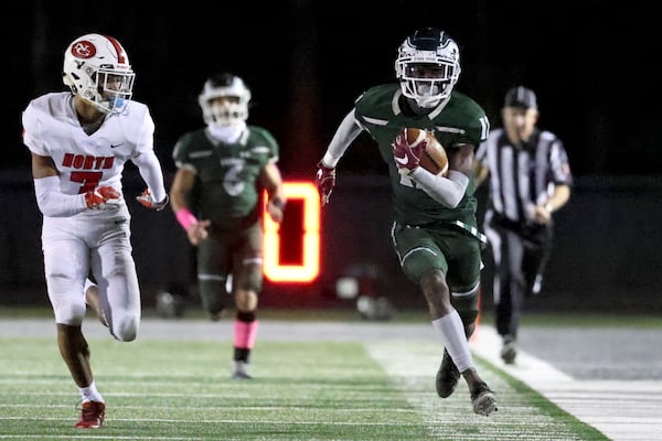 Collins Hill wide receiver Travis Hunter (12) makes a long catch against North Gwinnett.