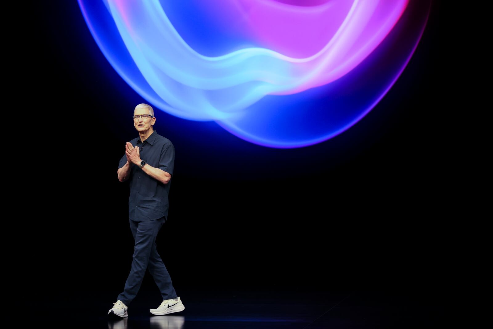 Apple CEO Tim Cook talks on the stage during an announcement of new products at Apple headquarters Monday, Sept. 9, 2024, in Cupertino, Calif. (AP Photo/Juliana Yamada)