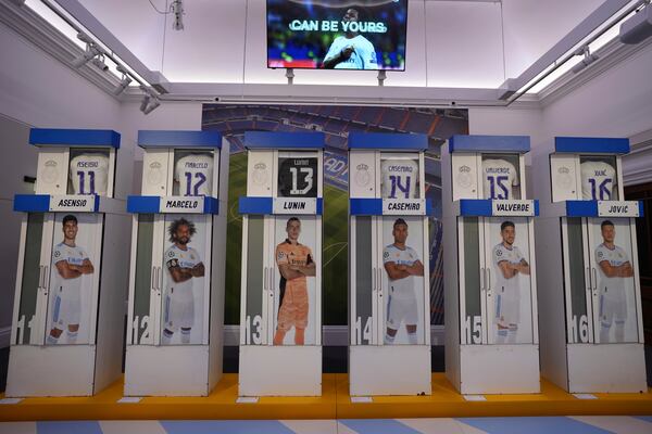 The Real Madrid first-team changing room lockers from Santiago Bernabeu Stadium are displayed at Sotheby's auction rooms in London, Wednesday, Nov. 20, 2024. The sale features 24 individual lockers previously used by footballers including Cristiano Ronaldo, David Beckham and Zinedine Zidane. (AP Photo/Kin Cheung)