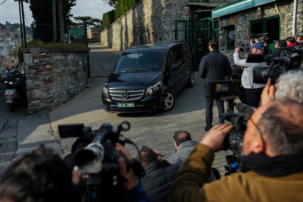 A van, which is believed to carry Russian diplomats, leaves U.S. Consul General residence following a meeting with U.S. counterparts to discuss operation of embassies, in Istanbul, Turkey, Thursday, Feb. 27, 2025. (AP Photo/Francisco Seco)