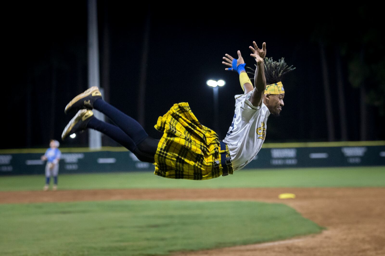 SAVANNAH, GA - JULY 12, 2022: The Savannah BananaÕs Dancing First Base Coach Maceo performs during a game with the Holly Springs Salamanders. (AJC Photo/Stephen B. Morton)