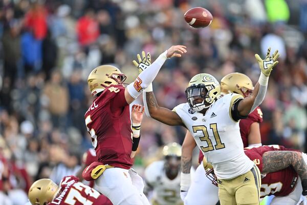 Georgia Tech defensive lineman Kyle Kennard (31) pressures Boston College quarterback Phil Jurkovec on a pass play during Boston College’s 41-30 victory at Bobby Dodd Stadium in Atlanta on Nov. 13, 2021. (Photo by Danny Karnik/Georgia Tech Athletics)