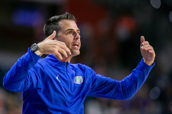 Florida head coach Todd Golden coaches form the siideline during the first half of an NCAA college basketball game against Jacksonville Thursday, Nov. 7, 2024, in Gainesville, Fla. (AP Photo/Alan Youngblood)