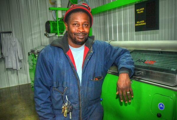 Sam Smith of Valdosta is a certified chef, manages the farm, runs the mill, bottles the oil, applies the labels and handles the shipping.
Contributed by Chris Hunt for The Atlanta Journal-Constitution