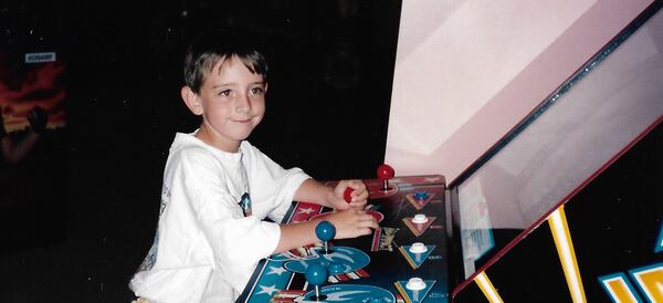 Young Bill King plays an arcade video game during his eighth birthday party at Challenges at North DeKalb Mall. (Courtesy of the King family)