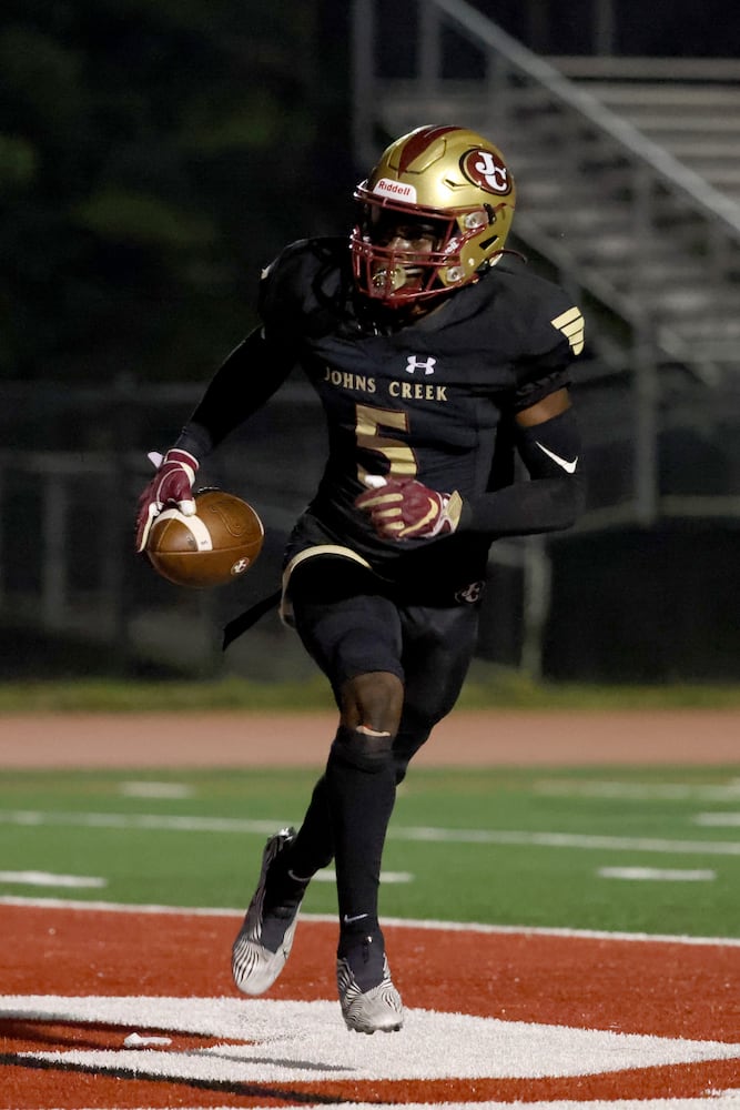 Sept. 24, 2021 - Johns Creek, Ga: Johns Creek wide receiver Josh Thompson (5) reacts after a touchdown catch during the second half against Riverwood at Johns Creek high school Friday, September 24, 2021 in Johns Creek, Ga.. Johns Creek won 40-32. JASON GETZ FOR THE ATLANTA JOURNAL-CONSTITUTION