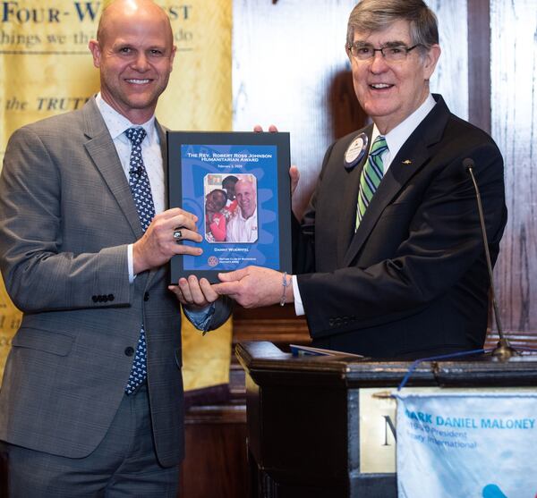 Danny Wuerffel receives The Rev. Robert Ross Johnson Humanitarian Award from Jim Breedlove on Monday in Buckhead. CONTRIBUTED