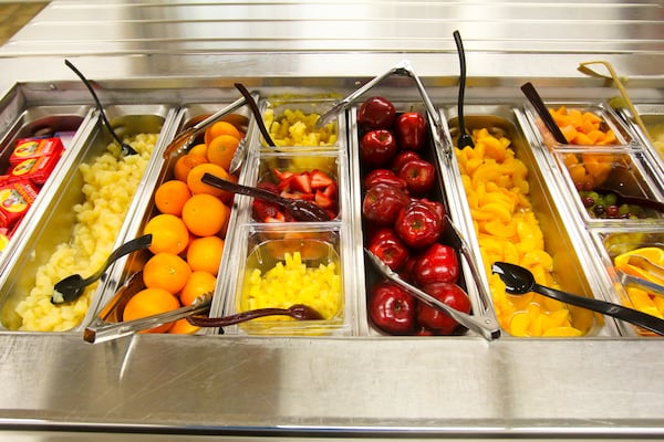 The fruit bar in the cafeteria at Talawanda High School, Thursday, Apr. 3, 2014. GREG LYNCH / STAFF When students were served healthier lunches, their test scores increased. according to a major study. (AJC File)