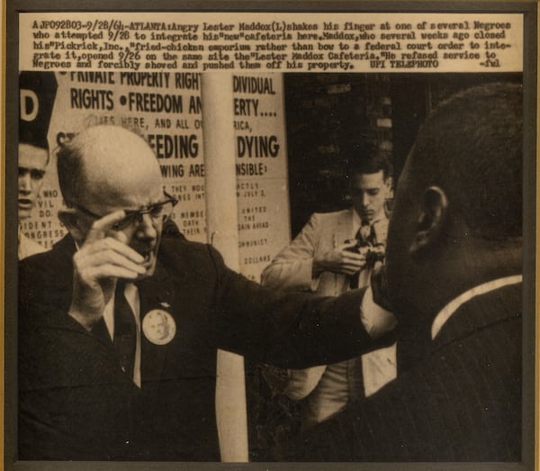 John Pruitt (center) covering future Georgia governor Lester Maddox in September, 1964, as Maddox refuses to comply with a federal order to integrate his restaurant. CONTRIBUTED BY JOHN PRUITT