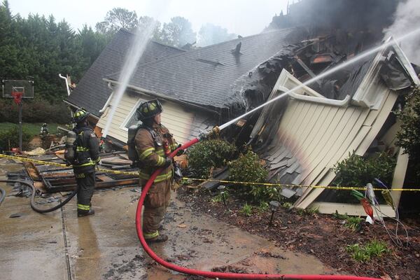 Cherokee firefighters battle a blaze that destroyed a BridgeMill home overnight.