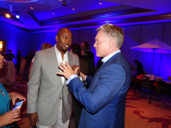 Sam Champion greets Ryan Cameron of V-103. CREDIT: Rodney Ho/rho@ajc.com