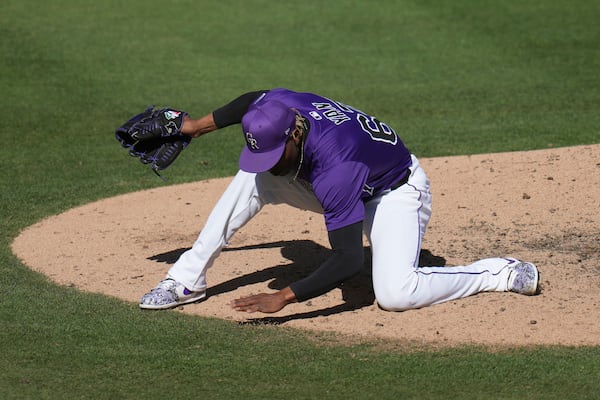 Colorado Rockies pitcher Jefry Yan celebrates a strikeout against Seattle Mariners Jacob Nottingham during the seventh inning of a spring training baseball game, Sunday, March 2, 2025, in Scottsdale, Ariz. (AP Photo/Ross D. Franklin)