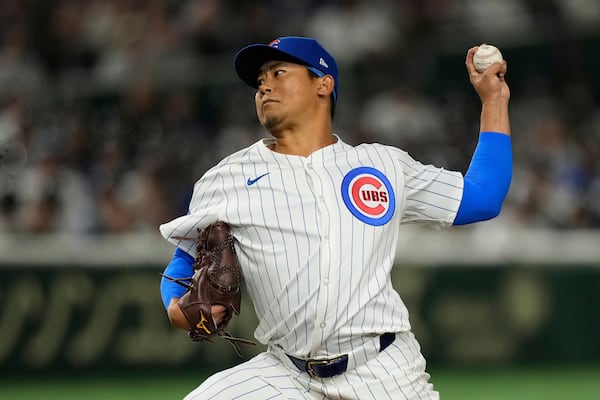 Chicago Cubs starting pitcher Shota Imanaga throws to the Los Angeles Dodgers in the first inning of an MLB Japan Series baseball game in Tokyo, Japan, Tuesday, March 18, 2025. (AP Photo/Hiro Komae)