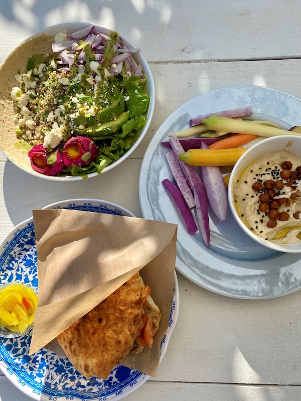 This spread from Daily Chew includes an all-day breakfast bowl (top left), hummus plate and smoked salmon pita. Wendell Brock for The Atlanta Journal-Constitution