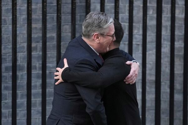 Britain's Prime Minister Keir Starmer, embraces and greets Ukraine's President Volodymyr Zelenskyy in Downing Street, London, Saturday, March 1, 2025. (AP Photo/Kin Cheung)