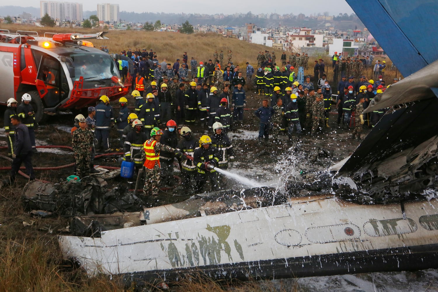 Photos: Kathmandu plane crash kills dozens, Nepal police say