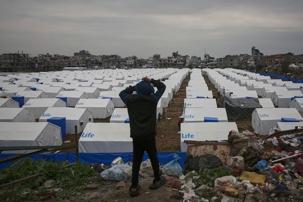 A boy looks over a newly established tent camp for displaced Palestinians whose homes were damaged by Israeli army strikes in the Zeitoun neighborhood of Gaza City on Friday, March 7, 2025. (AP Photo/Jehad Alshrafi)