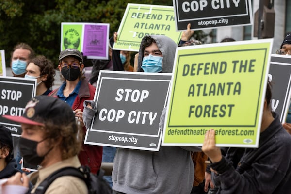 Demonstrators protest the construction of a new public safety training center during a press conference at City Hall in Atlanta on Tuesday, January 31, 2023. (Arvin Temkar / arvin.temkar@ajc.com)