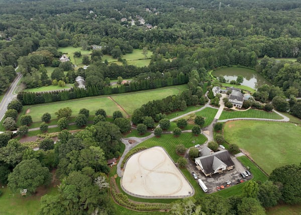 Aerial photo shows Kyle Hester’s horse farm house (foreground) and proposed recreational sports complex area (background) in Milton. (Hyosub Shin / Hyosub.Shin@ajc.com)