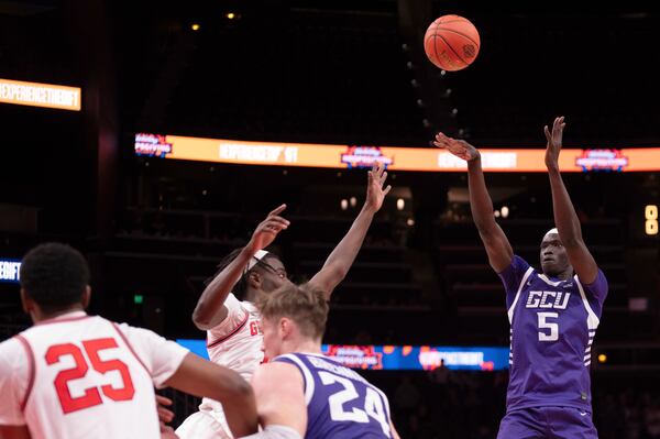 Grand Canyon forward Lok Wur (5) shoots during the first half of an NCAA college basketball game against Georgia, Saturday, Dec. 14, 2024, in Atlanta. (AP Photo/Kathryn Skeean)