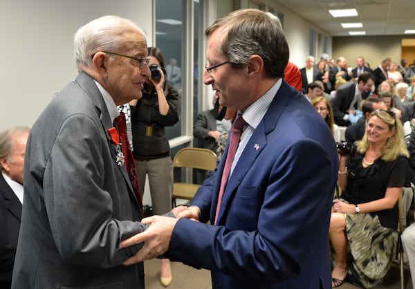 Denis Barbet, consul general of France in Atlanta, presented the Legion of Honor to Eddie Sessions. The National Order of the Legion of Honor is the oldest, most prestigious French decoration and recognizes those who rendered eminent services to the Republic of France or who have demonstrated exceptional courage, bravery and a spirit of sacrifice beyond the ordinary.