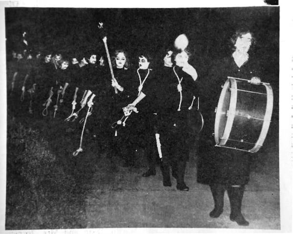 A school newspaper photo of “Rat Week” from the mid-1950s shows students with nooses around their necks. The use of nooses and hooded robes in school rituals that have echoes of the Ku Klux Klan continued for decades after the first African Americans enrolled at the college in the 1960s. COPY PHOTO