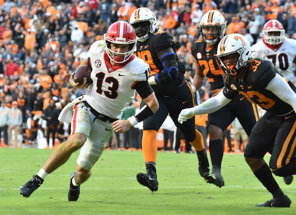 Georgia's quarterback Stetson Bennett (13) runs for a touchdown in the first half during a NCAA football game at Neyland Stadium in Knoxville on Saturday, November 13, 2021. (Hyosub Shin / Hyosub.Shin@ajc.com)