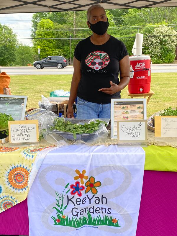 KeeYah Gardens owner Monica Booker sells a variety of microgreens at the Candler Black Market. Ligaya Figueras/ligaya.figueras@ajc.com
