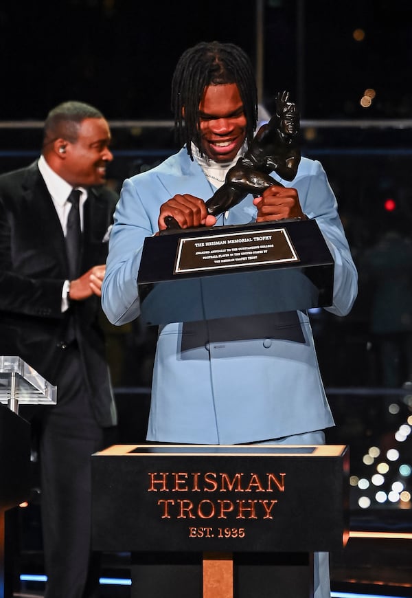 Colorado’s Travis Hunter reacts after winning the Heisman Trophy as the outstanding player in college football, Saturday, Dec. 14, 2024, in New York. (Todd Van Emet/Heisman Trust via AP, Pool)