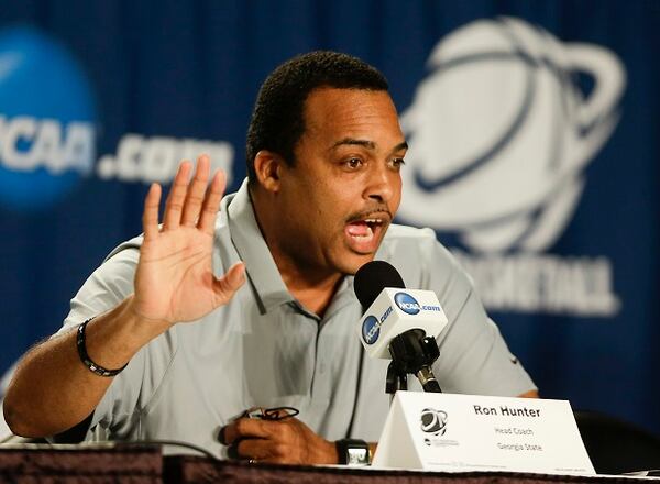 Georgia State head coach Ron Hunter speaks at a news conference for an NCAA tournament third round college basketball game, Friday, March 20, 2015, in Jacksonville, Fla. Georgia State plays Xavier on Saturday. (AP Photo/John Raoux) Ron Hunter offers his apology to our nation's President. (AP photo/John Raoux)