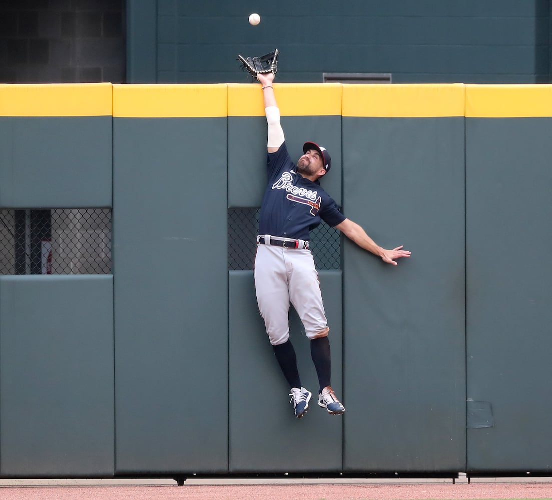 Braves outfielder Ender Inciarte can’t quite reach a 2-run home run by Travis D’Arnaud.   Curtis Compton ccompton@ajc.com