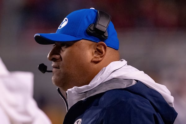 BYU head coach Kalani Sitake watches from the sideline in the first half of an NCAA college football game against Utah, Saturday, Nov. 9, 2024, in Salt Lake City. (AP Photo/Spenser Heaps)