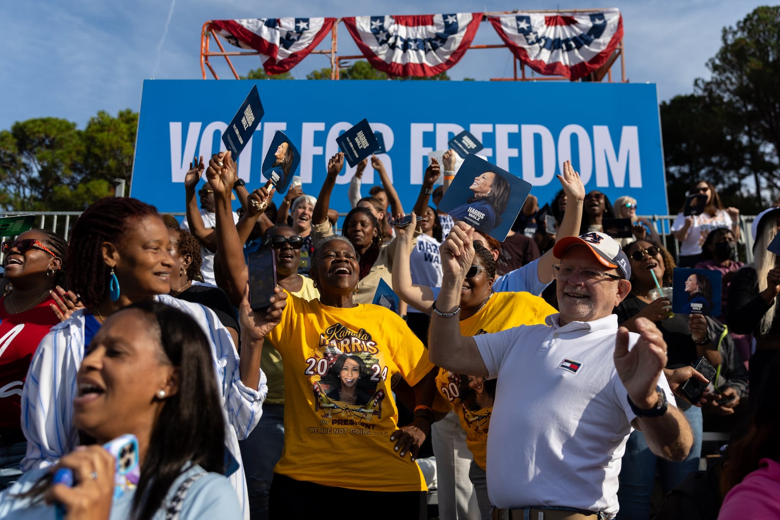 Supporters of Democratic presidential candidate Kamala Harris wait for her to speak during a campaign rally at the Atlanta Civic Center parking lot in Atlanta on Saturday, November 2, 2024. (Arvin Temkar / AJC)