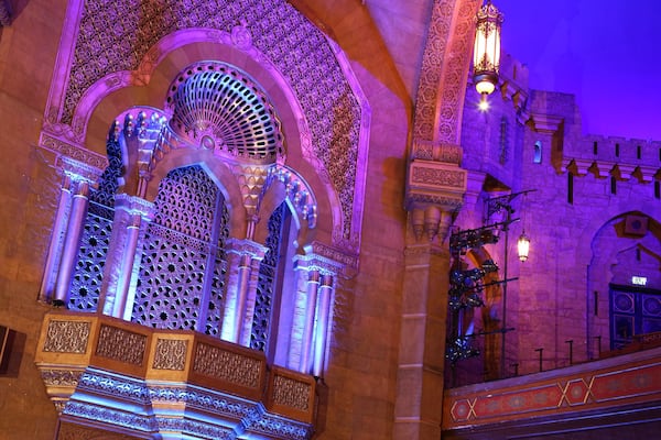 Looking like windows and a balcony opening onto an Arabian courtyard, this grate-covered opening contains two of the pipe chambers for the Fox’s Möller organ. Photo: Tyson Horne / tyson.horne@ajc.com