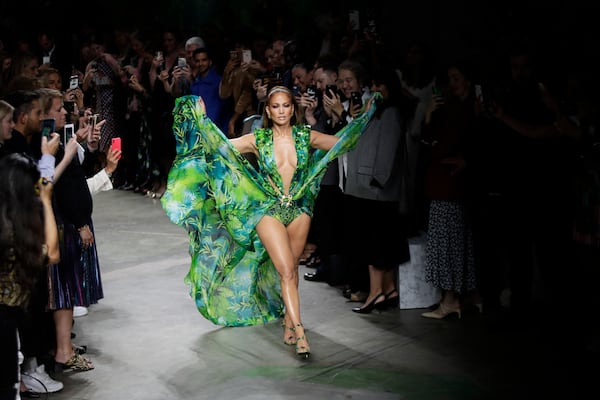 FILE - Actress Jennifer Lopez wears a creation as part of the Versace Spring-Summer 2020 collection, unveiled during the fashion week, in Milan, Italy, Friday, Sept. 20, 2019. (AP Photo/Luca Bruno, File)