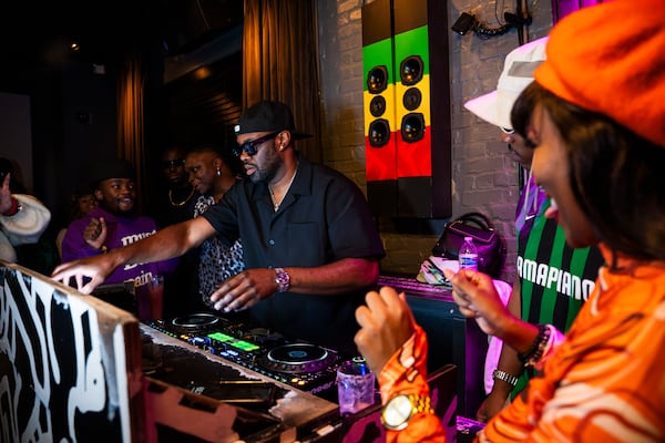 
Party-goers dance and enjoy the local scene at Bamba Tuesdays, a premier amapiano dance party hosted by DJ Kash in Atlanta, on Oct. 15, 2024. (Olivia Bowdoin for the AJC).