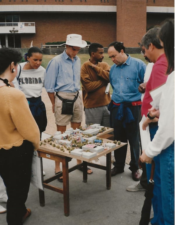 Volunteers studying 1996 Atlanta Olympic Village Model and getting ready to tour the grounds of Georgia Tech.