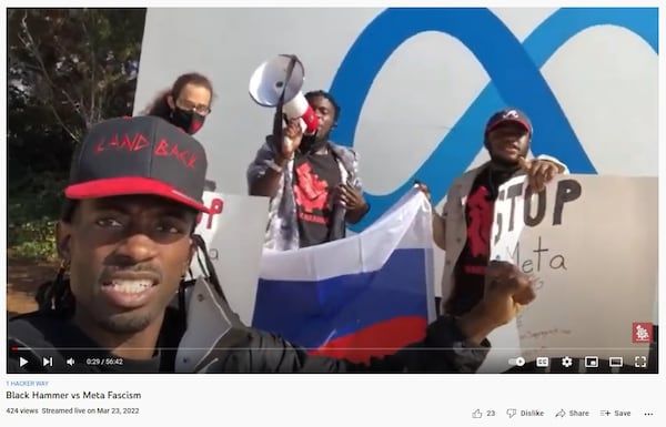 Black Hammer Party leader Gazi Kodzo, left, protested in March at Facebook headquarters in San Francisco over censorship of pro-Russian posts. Kodzo livestreamed the protest over YouTube. The U.S. Department of Justice on Friday said the trip was funded as part of a secret Russian influence campaign by an unregistered foreign agent.