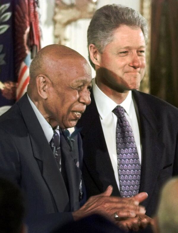 Herman Shaw, a Tuskegee Syphillis Study victim, smiles after receiving an official apology from President Bill Clinton in 1997. Associated Press