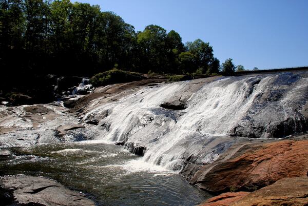 High Falls, located in High Falls State Park, is the tallest cascading waterfall south of Atlanta and is about 135 feet from the top to the bottom. 
Courtesy of the Georgia Department of Natural Resources.