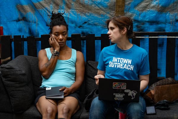 Tracy Woodard speaks to Yamesha Carr about her housing application on Friday, May 17, 2024. Tracy Woodard is an outreach worker with InTown Cares, an advocacy group serving people experiencing homelessness in metro Atlanta. (Ben Hendren for The Atlanta Journal-Constitution)