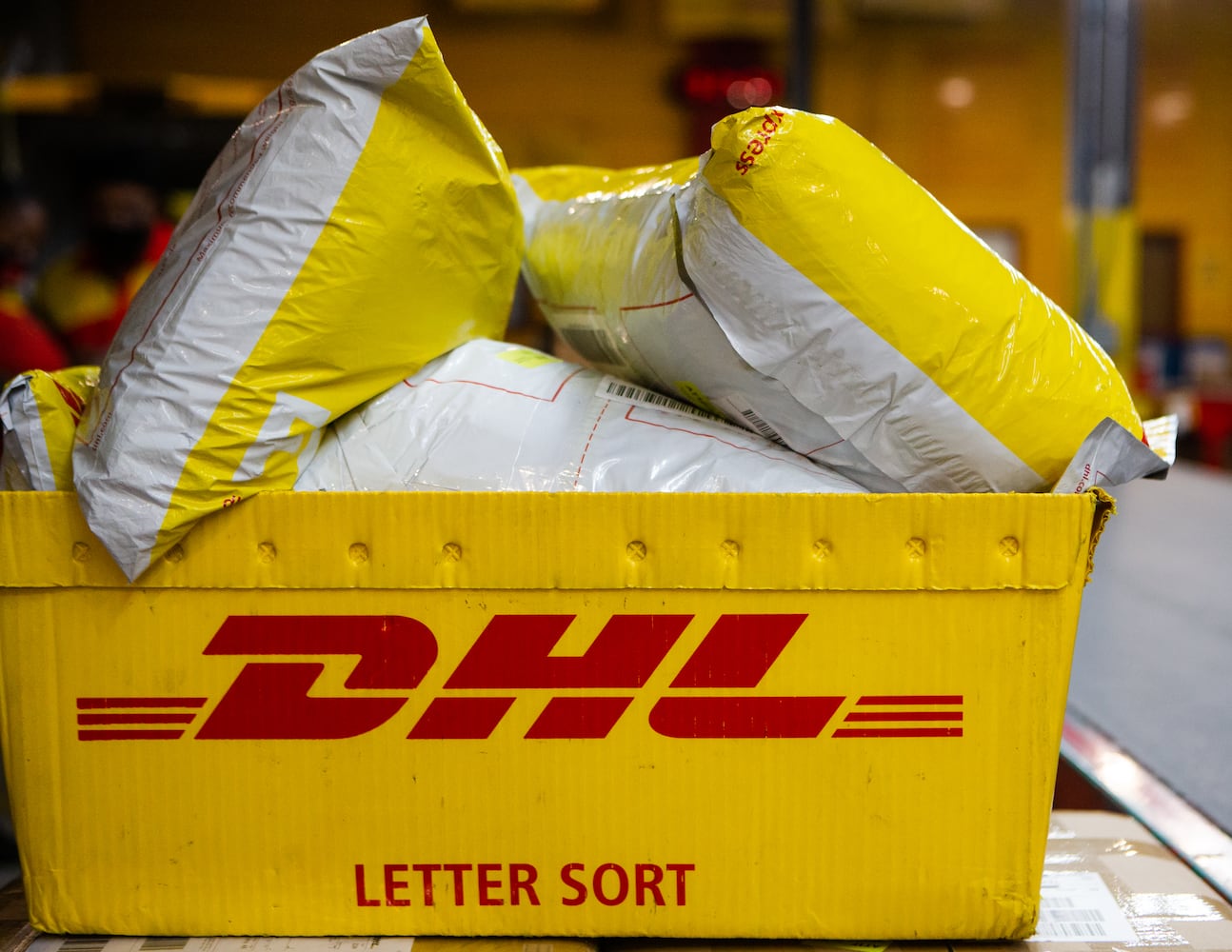 A box of DHL packages is prepared to be shipped on Wednesday, December 16, 2020, at DHL Express in Atlanta. Workers at the shipping center worked to fulfill orders during the holiday rush. CHRISTINA MATACOTTA FOR THE ATLANTA JOURNAL-CONSTITUTION.