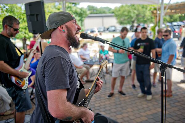 Anthony Crane (right) and Doug Gross with the band Wrong Way perform at Red Hare Brewery in Marietta during the company's third anniversary party on Saturday, August 23, 2014. JONATHAN PHILLIPS / SPECIAL