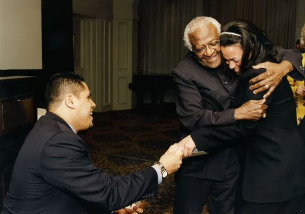 Joel Alvarado proposed to his future wife, Karcheik Sims-Alvarado in front this South African cleric and human rights activist Desmond Tutu. CONTRIBUTED