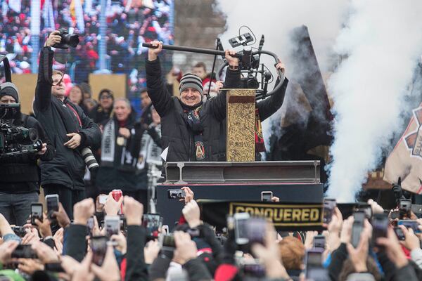 12/10/2018 -- Atlanta, Georgia -- Atlanta United head coach Gerardo "Tata" Martino is applauded after hammering the Golden Spike during the victory rally at the Home Depot Backyard Lot following the parade, Monday, December 10, 2018. The Atlanta United became the second major league team in Georgia to win a championship title. The Atlanta United beat the Portland Timbers during the MLS Championship that was hosted at Mercedes-Benz Stadium, Saturday, December 8. (ALYSSA POINTER/ALYSSA.POINTER@AJC.COM)