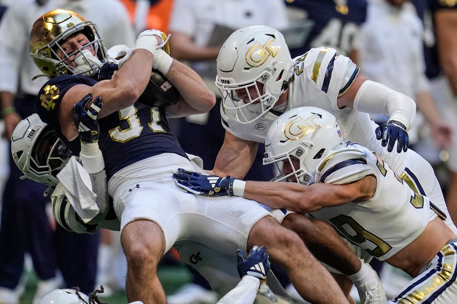 Notre Dame cornerback Max Hurleman (37) is hit by against Georgia Tech on a punt return during the first half of an NCAA college football game, Saturday, Oct. 19, 2024, in Atlanta. (AP Photo/Mike Stewart)