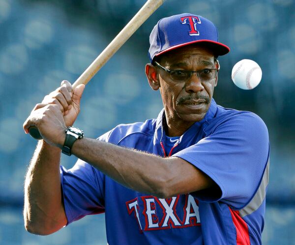 In this Sept. 3, 2014, file photo, Texas Rangers manager Ron Washington hits during fielding drills before the Rangers' baseball game against the Kansas City Royals in Kansas City, Mo.  AP file photo