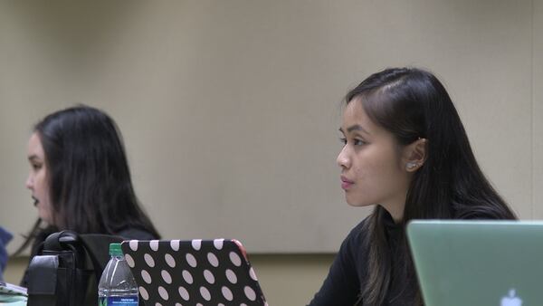 Christie Thuy Pham is a first-generation Vietnamese-American and senior at GSU. Here she listens during a class at GSU’s downtown Atlanta campus. Growing up as a first-generation American in rural Georgia was challenging because she was raised in an American setting, but at home firmly rooted in traditional Vietnamese culture. ERICA A. HERNANDEZ / EHERNANDEZ@AJC.COM